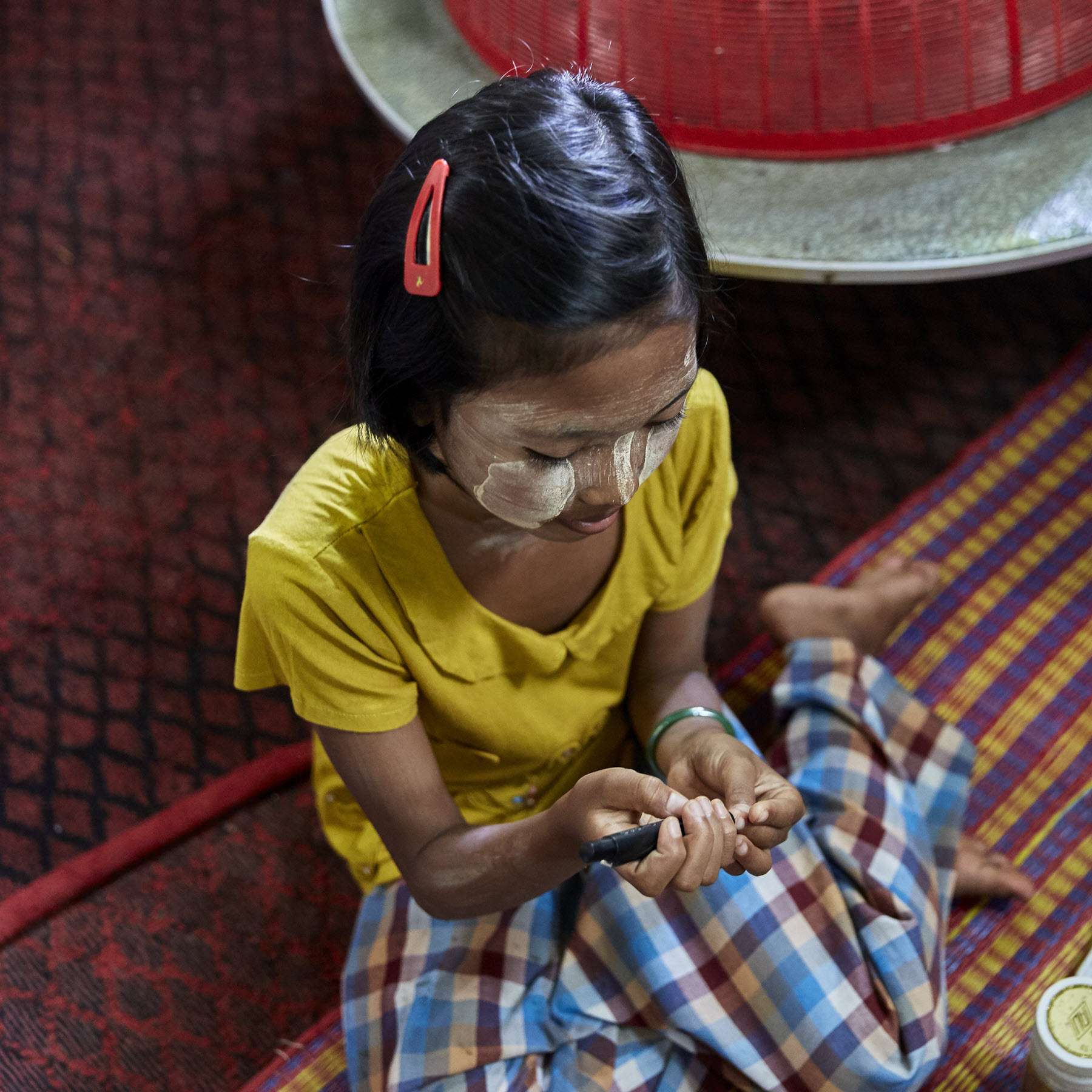 Image of a young girl checking her blood sugar levels